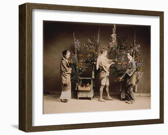 Japan, Japanese Women and Man Flower Arranging-null-Framed Giclee Print