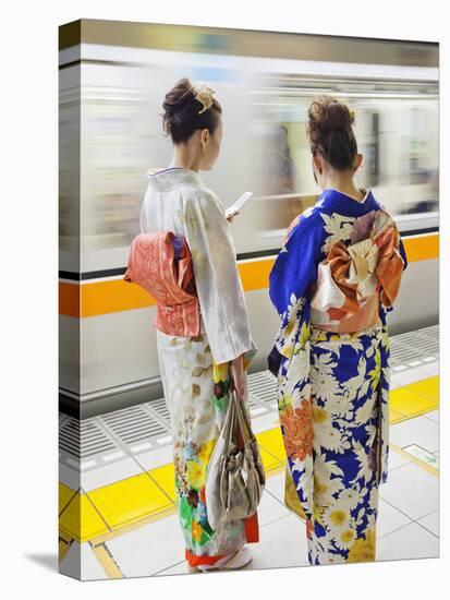 Japan, Tokyo, Girls in Kimono on Subway Platform-Steve Vidler-Stretched Canvas