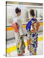 Japan, Tokyo, Girls in Kimono on Subway Platform-Steve Vidler-Stretched Canvas