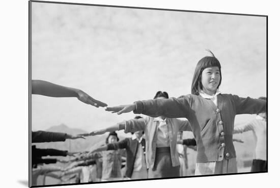 Japanese-American girls exercising at Manzanar, 1943-Ansel Adams-Mounted Photographic Print