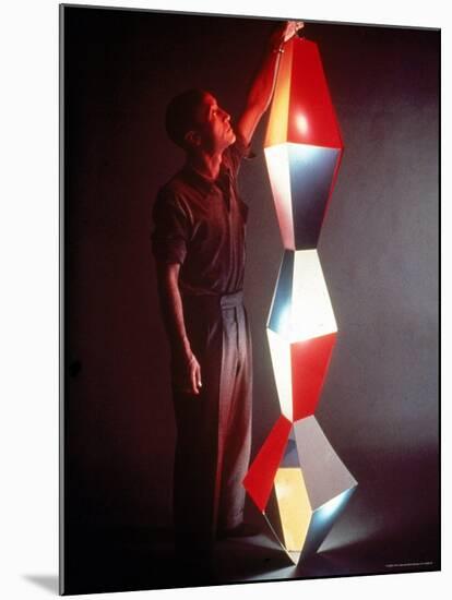 Japanese American Sculptor Isamu Noguchi Adjusting a Light Sculpture He Designed-Eliot Elisofon-Mounted Premium Photographic Print