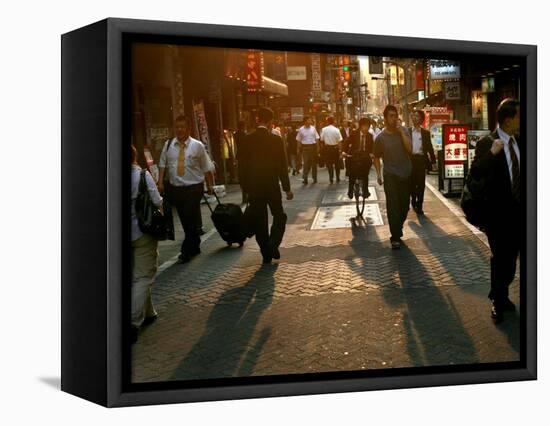 Japanese Commuters Walk Through a Tokyo Street on Their Way to the Train Stations-David Guttenfelder-Framed Stretched Canvas