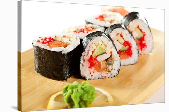 Japanese Cuisine - Sushi Roll with Salmon, Shrimps, Eel and Tobiko Inside. Nori Outside-svry-Stretched Canvas