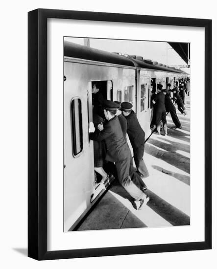 Japanese Students Employed as Uniformed 'Pushers' Cramming Commuter Cars, 1962-null-Framed Photo