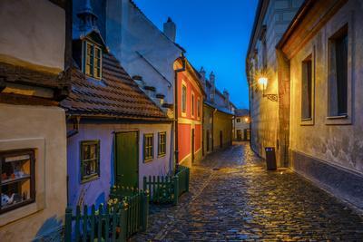 Europe, Czech Republic, Prague. Golden Lane buildings and street at night.