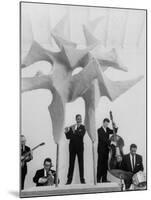 Jazz Drummer Chico Hamilton Playing with Band Behind Sculpture Called "Counterpoints"-Gordon Parks-Mounted Premium Photographic Print