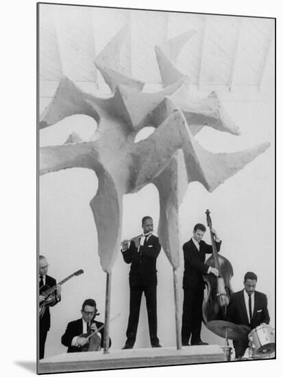 Jazz Drummer Chico Hamilton Playing with Band Behind Sculpture Called "Counterpoints"-Gordon Parks-Mounted Premium Photographic Print