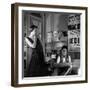 Jean Cocteau Sketching Model Elizabeth Gibbons in a Chanel Dress in His Hotel Bedroom-Roger Schall-Framed Premium Photographic Print