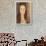 Jeanne Hebuterne-Amedeo Modigliani-Framed Art Print displayed on a wall