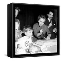 Jeanne Moreau Slicing a Cake-DR-Framed Stretched Canvas
