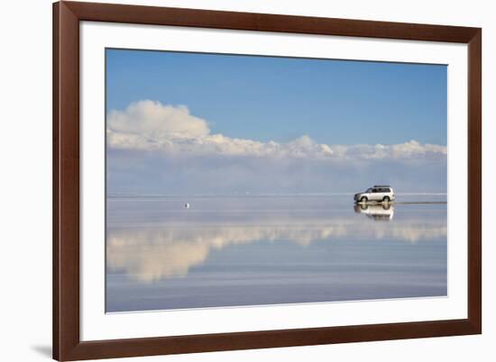 Jeep driving on the reflected surface of the salt flat, Salar de Uyuni, Potosi Department, Bolivia.-Keren Su-Framed Photographic Print