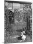 Jemima Puddle-Duck Posing in Front of Iron Gate Outside Beatrix Potter's Home-George Rodger-Mounted Photographic Print