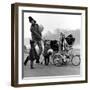 Jenny Boyd in Light Pants and Boots with Children, 1960s-John French-Framed Giclee Print