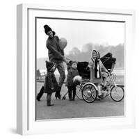 Jenny Boyd in Light Pants and Boots with Children, 1960s-John French-Framed Giclee Print