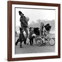 Jenny Boyd in Light Pants and Boots with Children, 1960s-John French-Framed Giclee Print