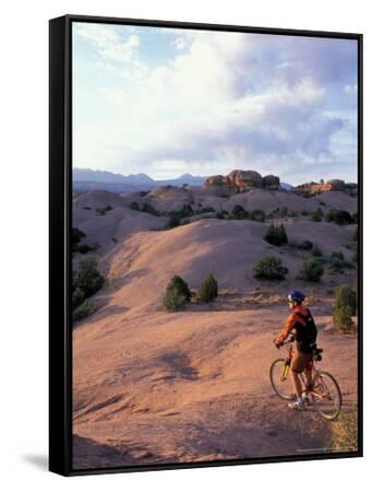 Mountain Biking on the Moab Slickrock Bike Trail, Navajo Sandstone
