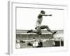 Jesse Owens in Action at the Long Jump During the Berlin Olympics, 1936-null-Framed Photographic Print