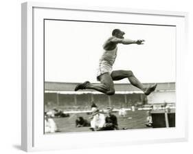 Jesse Owens in Action at the Long Jump During the Berlin Olympics, 1936-null-Framed Photographic Print