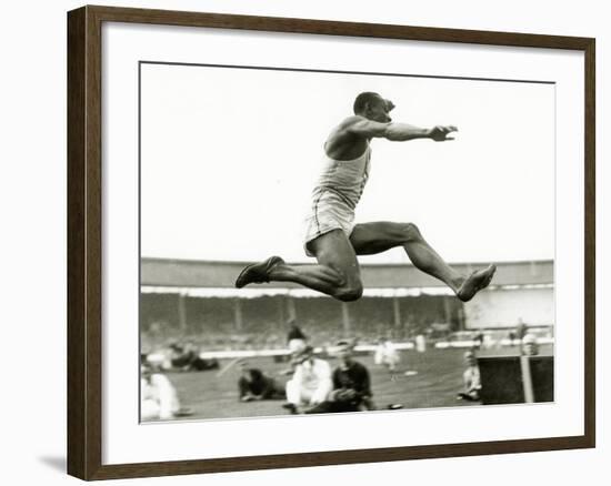 Jesse Owens in Action at the Long Jump During the Berlin Olympics, 1936-null-Framed Photographic Print