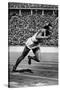 Jesse Owens Setting the 200 Meter Olympic Record at the Olympics in Berlin, Germany, 1936-null-Stretched Canvas