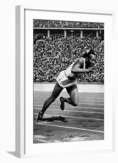 Jesse Owens Setting the 200 Meter Olympic Record at the Olympics in Berlin, Germany, 1936-null-Framed Art Print