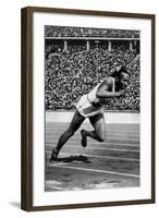 Jesse Owens Setting the 200 Meter Olympic Record at the Olympics in Berlin, Germany, 1936-null-Framed Art Print