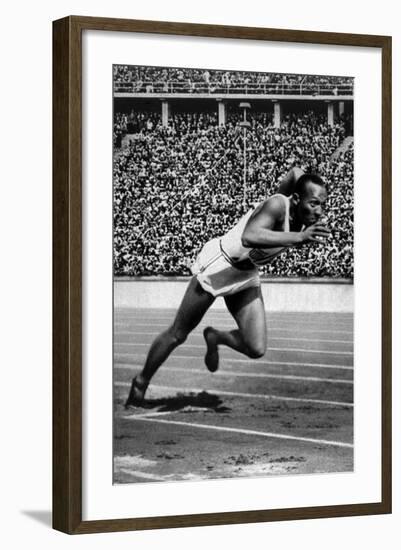 Jesse Owens Setting the 200 Meter Olympic Record at the Olympics in Berlin, Germany, 1936-null-Framed Art Print