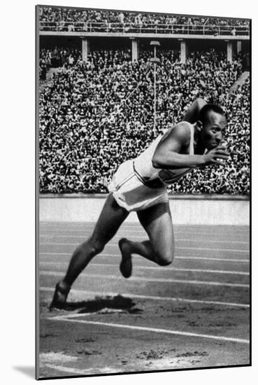Jesse Owens Setting the 200 Meter Olympic Record at the Olympics in Berlin, Germany, 1936-null-Mounted Art Print