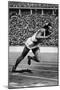 Jesse Owens Setting the 200 Meter Olympic Record at the Olympics in Berlin, Germany, 1936-null-Mounted Art Print