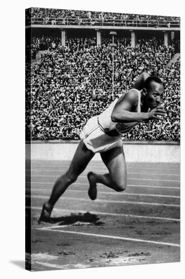 Jesse Owens Setting the 200 Meter Olympic Record at the Olympics in Berlin, Germany, 1936-null-Stretched Canvas