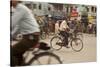 Jessore, Bangladesh. A man cycles to work through the centre of town.-Tom Martin-Stretched Canvas