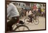 Jessore, Bangladesh. A man cycles to work through the centre of town.-Tom Martin-Framed Photographic Print