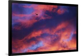 Jet Among Clouds at Sunset-null-Framed Photographic Print