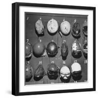 Jet Pilot Helmets and Goggles Hanging on Hooks-Charles E^ Steinheimer-Framed Photographic Print