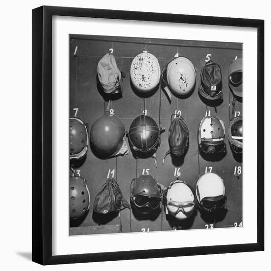 Jet Pilot Helmets and Goggles Hanging on Hooks-Charles E^ Steinheimer-Framed Photographic Print
