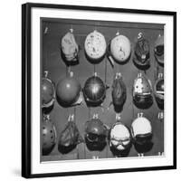 Jet Pilot Helmets and Goggles Hanging on Hooks-Charles E^ Steinheimer-Framed Photographic Print