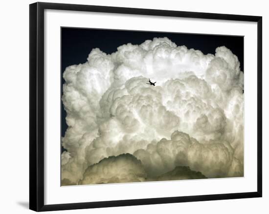 Jetliner Flies into a Cloud Bank as it Descends into the Washington D.C. Area-null-Framed Photographic Print