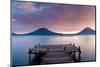 Jetty in a lake with a mountain range in the background, Lake Atitlan, Santa Cruz La Laguna, Wes...-null-Mounted Photographic Print