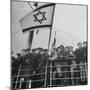 Jewish Immigrants, Arriving in Haifa Aboard Refugee Ship, Waving Future Flag of the State of Israel-Dmitri Kessel-Mounted Premium Photographic Print