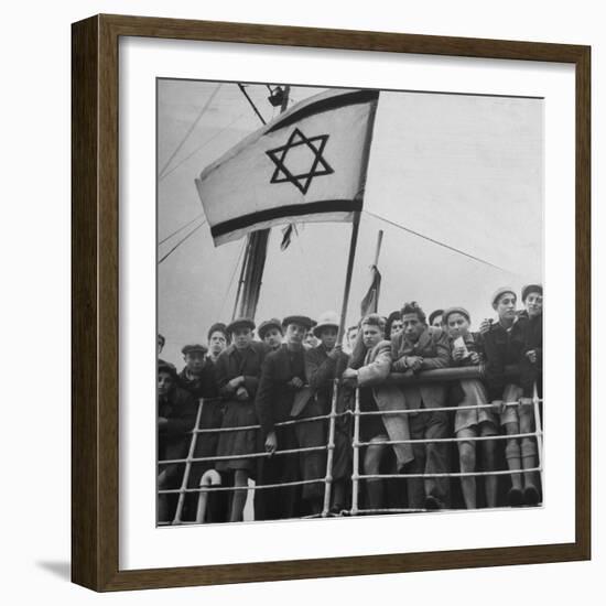 Jewish Immigrants, Arriving in Haifa Aboard Refugee Ship, Waving Future Flag of the State of Israel-Dmitri Kessel-Framed Photographic Print