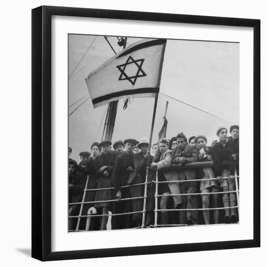 Jewish Immigrants, Arriving in Haifa Aboard Refugee Ship, Waving Future Flag of the State of Israel-Dmitri Kessel-Framed Photographic Print