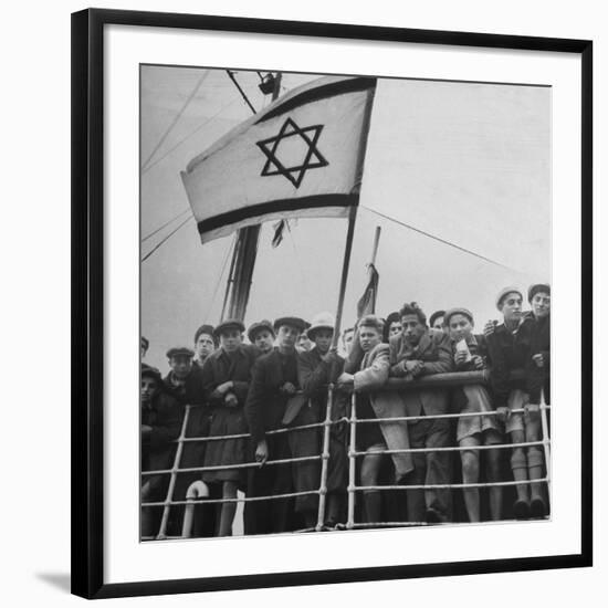 Jewish Immigrants, Arriving in Haifa Aboard Refugee Ship, Waving Future Flag of the State of Israel-Dmitri Kessel-Framed Photographic Print