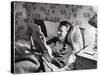 Jimmy Stewart, Dressed in Silk Pajamas Reading Magazine in Bed in Family Home-Peter Stackpole-Stretched Canvas