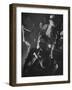 Jitterbugging at La Rose Rouge, with Saxophones Being Played in Foreground-Gjon Mili-Framed Photographic Print