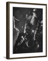 Jitterbugging at La Rose Rouge, with Saxophones Being Played in Foreground-Gjon Mili-Framed Photographic Print