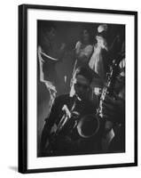 Jitterbugging at La Rose Rouge, with Saxophones Being Played in Foreground-Gjon Mili-Framed Photographic Print