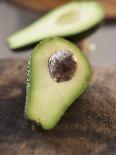 Avocado, Halved, on Old Chopping Board-Jo Kirchherr-Photographic Print