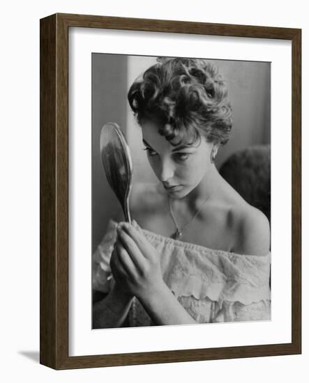 Joan Collins Studies Her Reflection-Associated Newspapers-Framed Photo