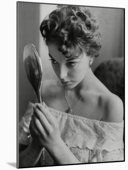 Joan Collins Studies Her Reflection-Associated Newspapers-Mounted Photo