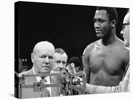 Joe Frazier at the Weigh in for His Fight Against Muhammad Ali-John Shearer-Stretched Canvas